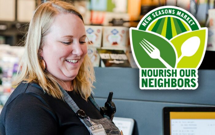 A woman works at a grocery store checkout; to her right is a green logo with a fork and a field that says New Seasons Market - Nourish our neighbors.