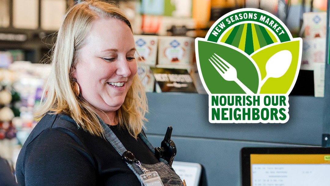 A woman works at a grocery store checkout; to her right is a green logo with a fork and a field that says New Seasons Market - Nourish our neighbors.
